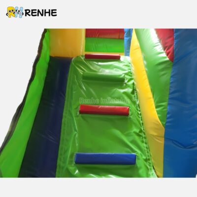 Cheerful Yellow and Green Bounce House with Blue Turrets for Backyard Entertainment